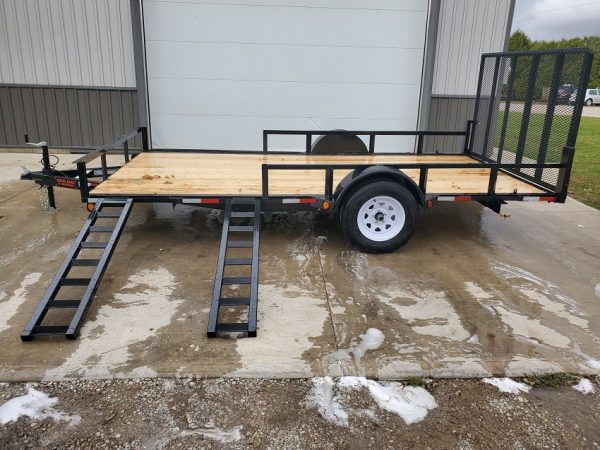 Left side of the 2021 Trail King 82x14 ATV trailer with ramps extended