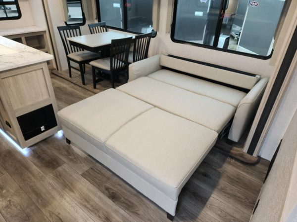 View of the pull-out couch in the 2023 Alta 2810-KIK