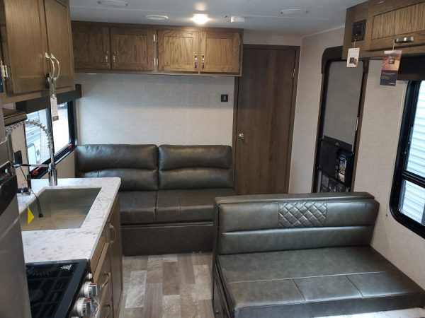 View of the couch and living space inside the 2021 Della Terra 250BH - Bunk house with King Front Bed