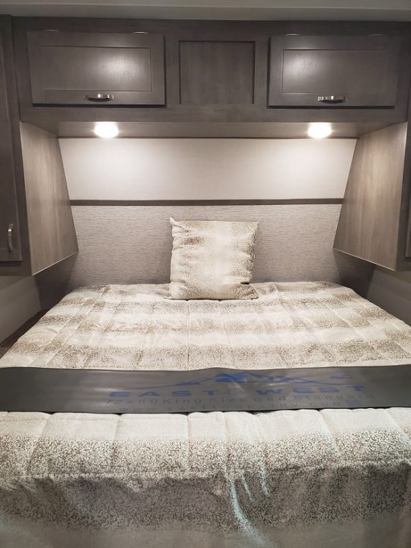View of the king bed inside the 2021 Alta Travel Trailers 2850-KRL