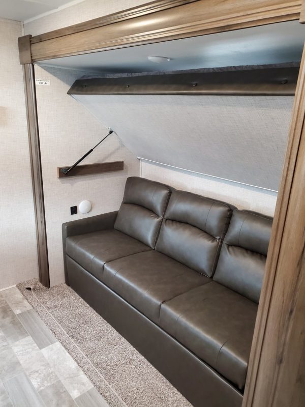 View of the bunks folded away inside the 2021 Della Terra 312BH Dual Slide Bunk House