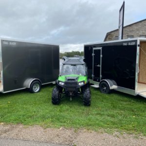Two 2022 Tow Tek 6x12 Trail Blazer UTV Special Edition angled next to one another.