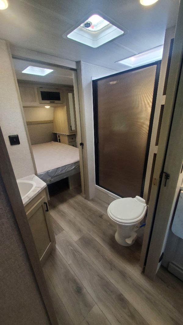 Bathroom and shower in the 2022 East to West Alta 2900KBH Bunk House