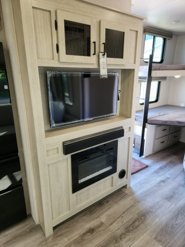 Fireplace and TV inside the 2023 Alta 3100KXT Xtreme 365