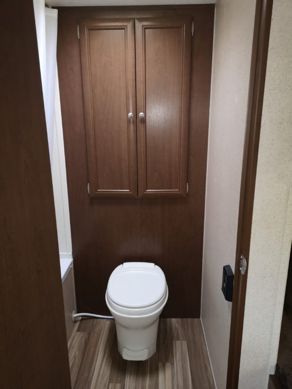 View of the toilet and bathroom storage inside the 2017 Shasta Oasis Classic Series M-18BH