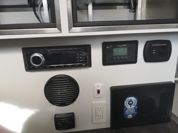 View of the stereo, electrical and other controls inside the 2024 VIDA Aire80